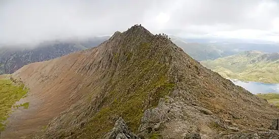 Image 10Crib GochPhoto: David IliffCrib Goch is an arête in Snowdonia national park, Wales, reaching 923 m (3,028 ft) above mean sea level. It is a popular destination for mountaineering, but even experienced climbers have suffered fatalities on it. It is also the wettest spot in the United Kingdom, with an average of 4,473 millimetres (176.1 in) rainfall a year over the past 30 years.More featured pictures